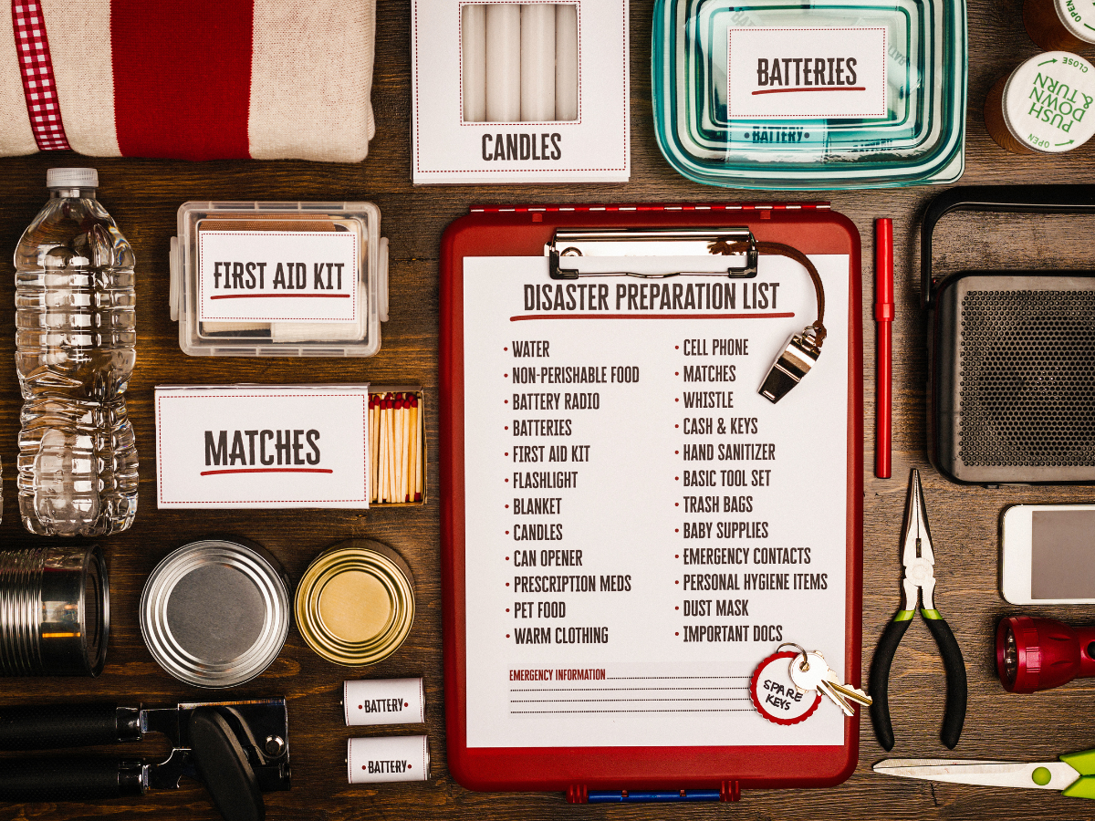 A picture of a disaster preparation checklist with many items around it.